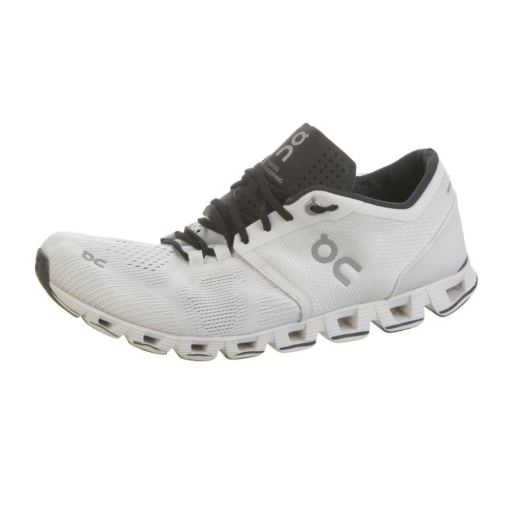On Running White and Black Sneakers with Distinctive Sole